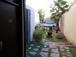 Um jardim em Villaggio Hotel Boutique