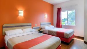 
a hotel room with two beds and two lamps at Motel 6-Sepulveda, CA - Los Angeles - Van Nuys - North Hills in North Hills
