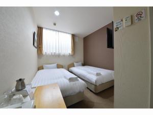 Gulta vai gultas numurā naktsmītnē A-GATE Hotel Hakodate