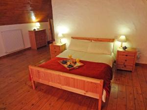 a bedroom with a bed with a tray of food on it at The Old School in Ballyheigue