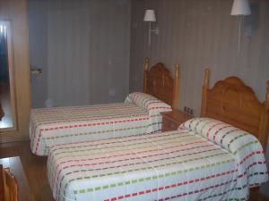 Postel nebo postele na pokoji v ubytování Hotel Corona de Castilla