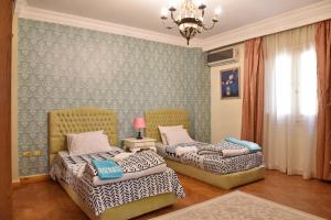 Säng eller sängar i ett rum på Royal Residence Families Only