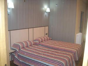 Postel nebo postele na pokoji v ubytování Hotel Corona de Castilla