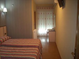 Postel nebo postele na pokoji v ubytování Hotel Corona de Castilla