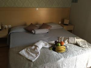Postel nebo postele na pokoji v ubytování Aphrodite Hotel Syros