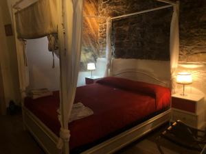 A bed or beds in a room at Cantina del Pescatore