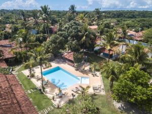 an aerial view of a resort with a swimming pool at Pousada Estalagem Vila Tania in Itaúnas