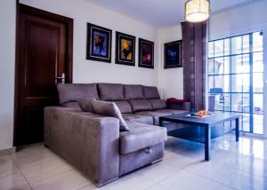 a living room with a couch and a table at Rooms in El Medano in El Médano