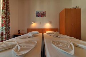Posteľ alebo postele v izbe v ubytovaní White Rock Apartments