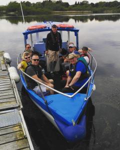
people on a small boat in the water at Blackwater Eco Pods in Villierstown
