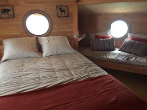 En eller flere senger på et rom på cabane flottante Millenium