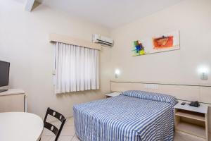 Postel nebo postele na pokoji v ubytování Hotel Express Canoas