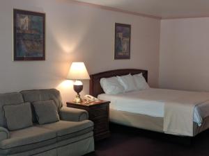 A bed or beds in a room at Saddle West Casino Hotel