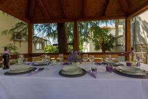 a table with a white table cloth and wine glasses at One-Bedroom Apartment in Crikvenica XLV in Dramalj