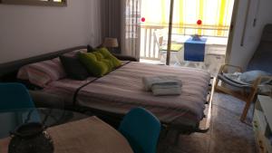 A bed or beds in a room at Residencial Colibrí