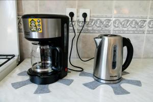 Příslušenství pro přípravu čaje a kávy v ubytování Studio 35 Busteni