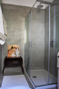 a shower with a glass door in a bathroom at Casa Romeo in Acireale +47 photos