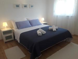 Postel nebo postele na pokoji v ubytování Apartman s pogledom