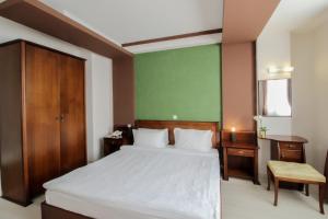 Voodi või voodid majutusasutuse Hotel Aleksandrija toas
