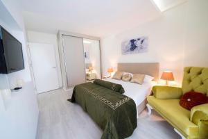 Кровать или кровати в номере Karia Plus City Apartments
