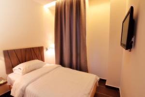 Postel nebo postele na pokoji v ubytování 9 Square Hotel - Petaling Jaya