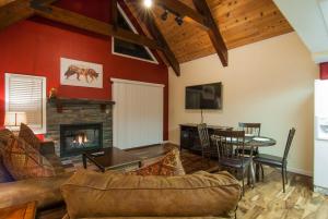 a living room with a couch and a fireplace at North Lake Lodges & Villas in Incline Village