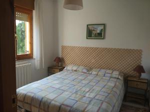 Postel nebo postele na pokoji v ubytování Chalet en el Orbigo