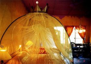 a plastic covering a bed in a room at HELGASFOLLY Anti Hotel Residence in Kandy