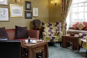 a living room with couches and chairs and a table at Best Western Forest and Vale Hotel in Pickering