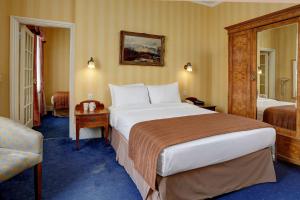 Ein Bett oder Betten in einem Zimmer der Unterkunft Best Western Swiss Cottage Hotel