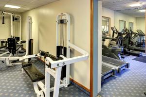 a gym with treadmills and elliptical machines at Passage House Hotel in Newton Abbot