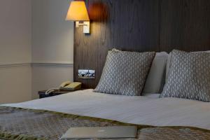 A bed or beds in a room at Best Western Ipswich Hotel & Spa 