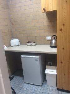 Kuchyň nebo kuchyňský kout v ubytování Alexander Motor Inn