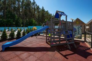 a playground with a blue slide and a ladder at Przystań Rozewie in Jastrzębia Góra +4 photos