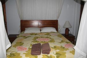 Postel nebo postele na pokoji v ubytování Ogek Home Stay
