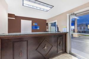 a bar in a room with a window at Days Inn by Wyndham Jacksonville in Jacksonville +14 photos
