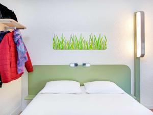 Postel nebo postele na pokoji v ubytování Hotel Ibis Budget Vichy