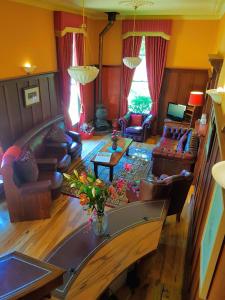 an aerial view of a living room with couches at Bridgefield Guest House in Margaret River Town +90 photos