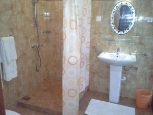 a bathroom with a sink and a shower at White Bridge House & Resort in Aluthgama +42 photos