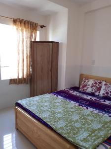 Postel nebo postele na pokoji v ubytování Cao Hung Hotel