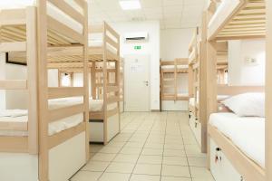 Postel nebo postele na pokoji v ubytování Gravitas Hostel