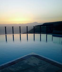 a swimming pool with a view of the water at Villa Flamboyan in Mogán