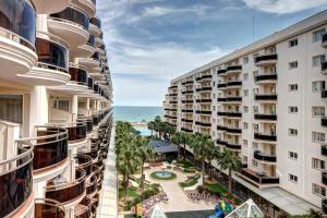 a view of the ocean from the balcony of a building at Peñiscola Plaza Suites in Peñíscola