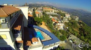 a view of a house with a swimming pool at Le Crillon in Broummana