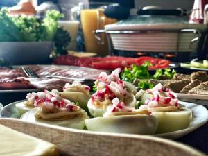 a plate of food on a table with food at Agroturystyka Barnilka in Klimkówka