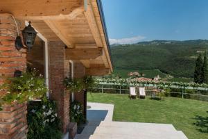a house with a patio with a view of the countryside at Agriturismo Caranatura in Novaglie