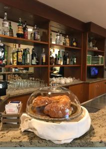 a plate of food on a counter in a bar at Hotel San Siro Fiera in Milan