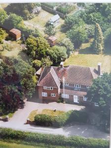 an aerial view of a house with a driveway at Chimneys B&B in Ipswich