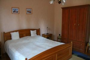 Postel nebo postele na pokoji v ubytování Ibolya Apartmanok