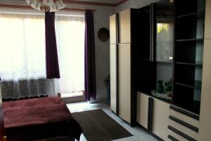 Postel nebo postele na pokoji v ubytování Ibolya Apartmanok